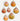 Seven scallop shell-shaped pendants with gold-tone hooks and trim in yellow, orange, pink, and white
