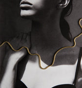 Woman wearing a gold chain