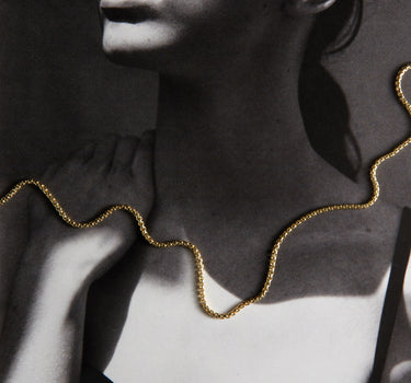 Woman wearing a gold chain