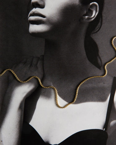 Woman wearing a gold chain