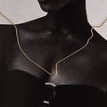 Woman wearing a gold chain