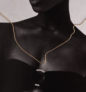 Woman wearing a gold chain