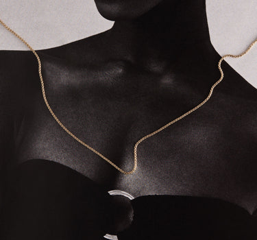 Woman wearing a gold chain