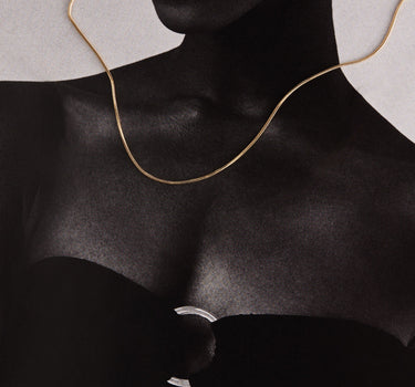 Woman wearing a gold chain